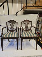 Front view of the two matching Hepplewhite-style armchairs