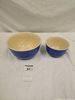 Both cobalt blue stoneware mixing bowls side by side