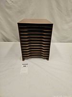 Front view showing fifteen horizontal slots