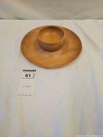 Top view of wooden platter with bowl centered