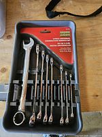 Front view of Husky tray with 8 wrenches and red label
