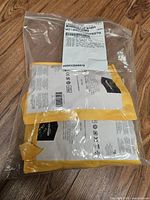 Outer clear bag containing three padded AmazonBasics envelopes