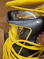 Main handheld steam cleaner with wrapped yellow cord