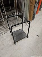 Full view of printer stand showing frame, shelf and casters