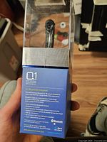 Front view of sealed BlueAnt Q1 headset package
