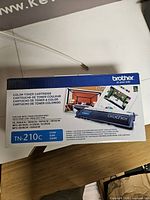 Front view of Brother TN-210C toner retail box