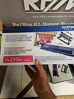 Front of Brother TN-210M box showing model and magenta color