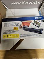Front of Brother TN-210Y retail box