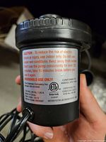 Label on pump showing model HB-55100B and 120 VAC rating