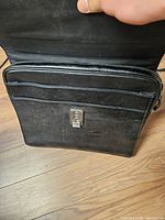 Front view showing leather exterior, Ecco clasp, overall wear