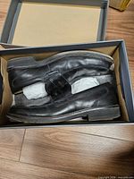 Loafers inside the box showing uppers and general condition