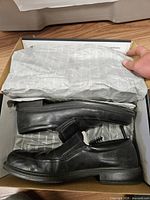Loafers inside original box with packing paper