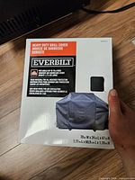 Front of Everbilt grill cover retail box with product image and branding