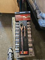 Front view of packaged Husky 18-piece socket set showing ratchet, extension and sockets