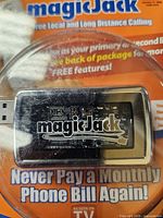 Front view of sealed MagicJack adapter packaging