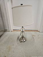 Full view of lamp showing overall design, shade, and base