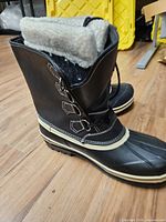 Side view of both boots displaying upper, lining, and toe shell