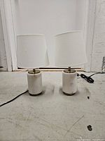 Both lamps side by side showing marble bases, shades and cords