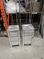 Front view of both mirrored nightstands showing three drawers each