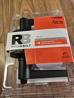 Front of clamshell package showing Reliabilt Dallas keyed entry matte black lever model 1658860