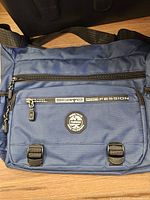 Front view showing Seaye Profession branding, front zipper, patch, strap attachment points
