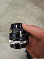 Side view of Sigma 28mm f/2.8 lens showing focus and aperture rings