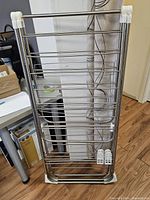 Rack folded flat against wall showing overall construction