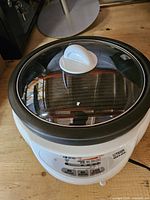 Hot pot with glass lid in place showing control panel