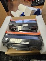 Two TN760 toner cartridges in foam inside box