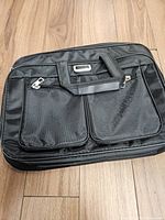 Front view of VAVK laptop bag showing overall style and pockets