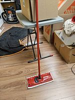 Full view of assembled mop standing on floor