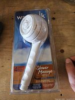 Front of sealed Waterpik SM-451(S) Shower Massage handheld shower head package
