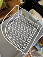 Top view showing two tiers and white coated metal construction