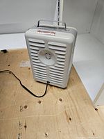 Rear view showing louvered vent, power cord and overall body condition