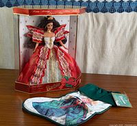 Barbie doll in box alongside Hallmark stocking