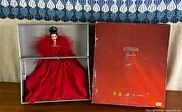Doll displayed inside open box next to outer cover
