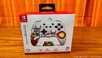Front of retail box showing controller image and Super Mario branding