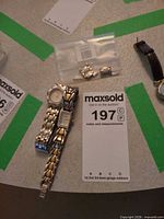 Wristwatch, spare bracelet, lot card