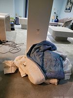 Pile of comforters and sheet