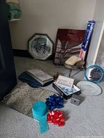 Group view showing plates, mirror, sleigh, wrapping papers and boxes