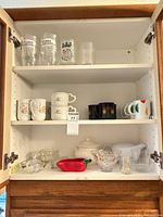 Cabinet showing entire assortment across three shelves