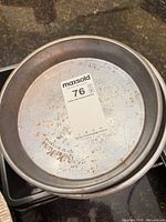 Round cake pan showing rust spots
