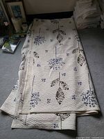 Quilt laid out showing full pattern and size