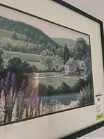 Close-up of framed countryside landscape print showing detail and mat
