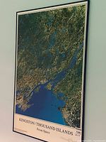 Full view of framed poster showing image and title