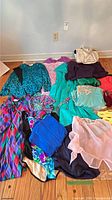 All garments and slippers laid out on floor