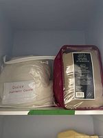 Both packaged bedding items on shelf