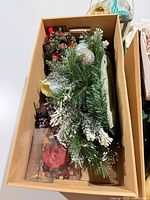Cardboard tray with frosted greenery, pine-cone sprays, ornaments