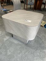 three-quarter view of table showing top and pedestal base