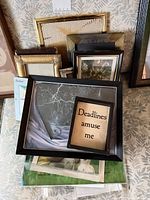 Stack of assorted frames showing variety of sizes, materials and finishes